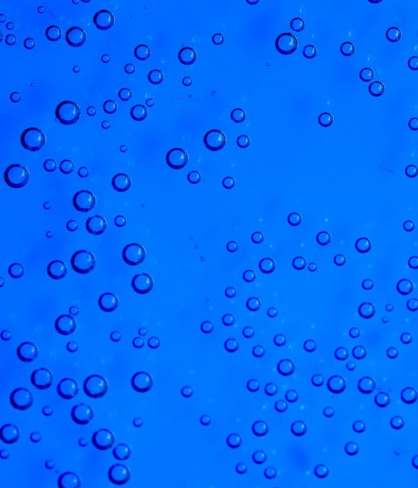 Abstract movement patterns in amber and carbon shades